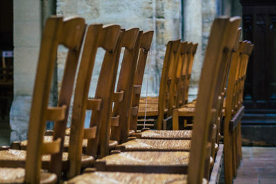 Empty chairs and tables in row