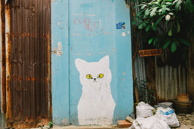 Graffiti on blue door