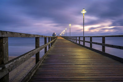 View of pier on bridge over sea against sky