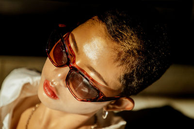 Close-up portrait of cute boy wearing eyeglasses
