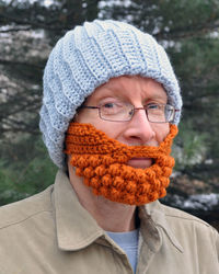 Portrait of mature man wearing knit hat and eyeglasses