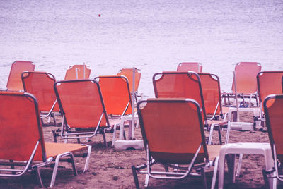 Empty chairs at beach