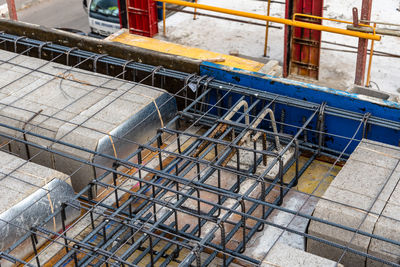 Construction site with steel formworks and reinforcing bars for pillars ready for concrete pouring