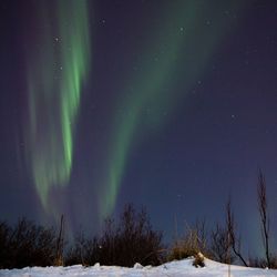 Snow covered landscape at night