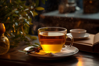 Hot mug tea. a glass of tea with decorative dishes.