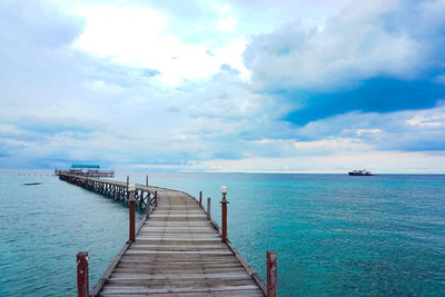 Pier over sea against sky