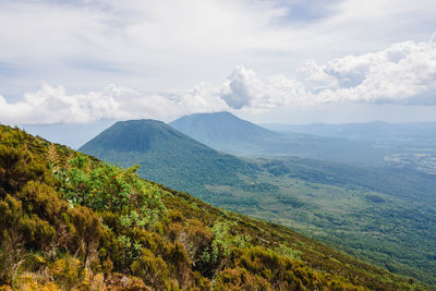 Mount gahinga and mount sabyinyo seen from mount muhabura in mgahinga gorilla national park , uganda