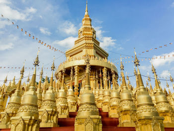 Low angle view of pagoda against building.