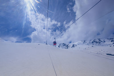 Scenic view of snow covered mountains against sky