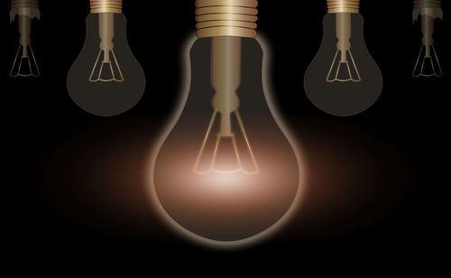 Close-up of illuminated light bulb