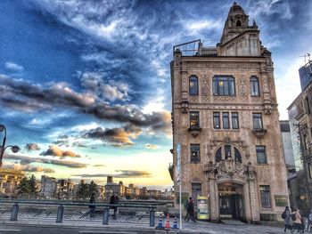 View of clock tower in city against sky