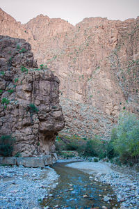 Rock formation on land against mountain