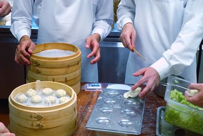 Midsection of man preparing food