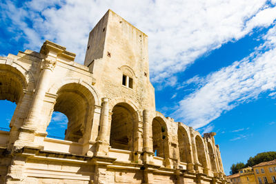 Low angle view of historical building against blue sky