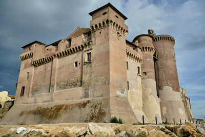 Low angle view of old building against sky
