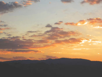 Scenic view of dramatic sky during sunset