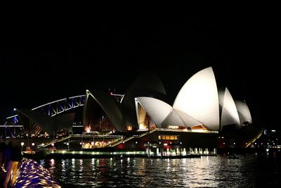 Illuminated bridge at night