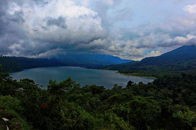 Scenic view of lake and mountains against sky