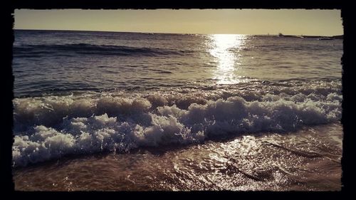 Scenic view of sea at sunset