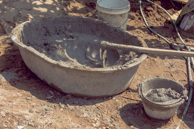 High angle view of old machine in sand