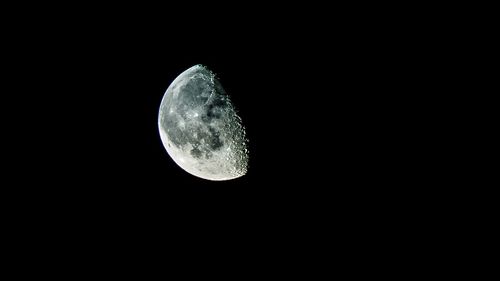 Low angle view of moon against clear sky at night