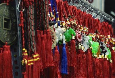 Close-up of chinese tassels hanging on display at market