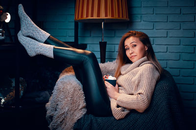 Woman sitting in a room