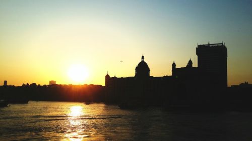 Silhouette of buildings at sunset