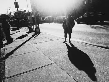 Shadow of people on road