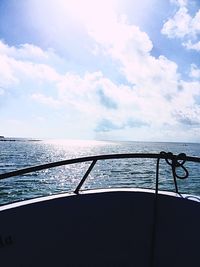 Boat sailing in sea against sky