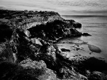 High angle view of rock formation on beach against sky