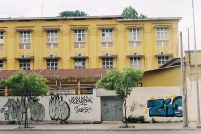 Graffiti on building against sky