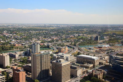 High angle view of buildings in city against sky