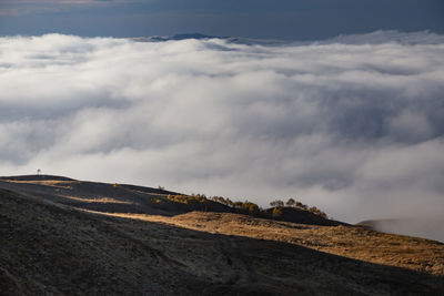 Scenic view of arid landscape against sky