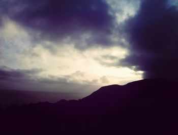 Clouds over mountain range