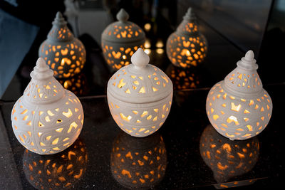 Close-up of illuminated decorations on table