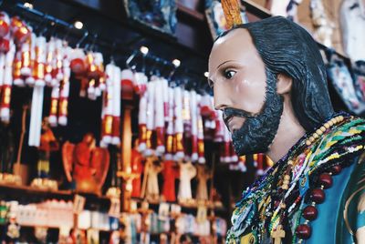 Low angle view of statue at store for sale