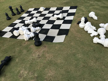High angle view of chess pieces on landscape
