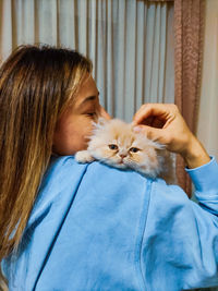 Midsection of woman with cat