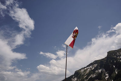 Low angle view of flag against sky