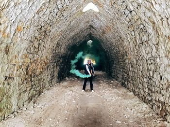 Full length of a man in the tunnel