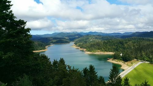 High angle view of river with mountains in background