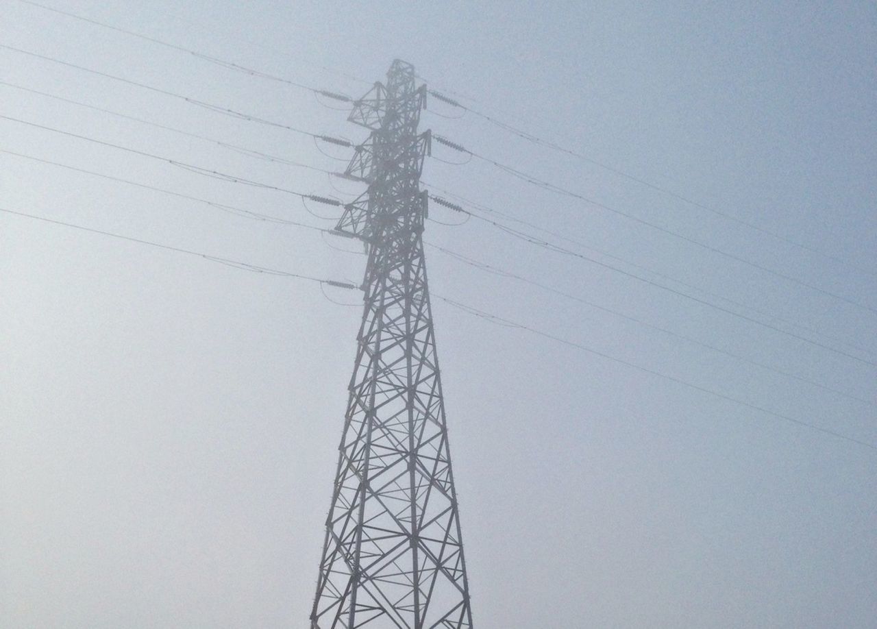 low angle view, electricity pylon, power line, electricity, power supply, connection, fuel and power generation, technology, cable, clear sky, sky, silhouette, tall - high, day, outdoors, no people, built structure, complexity, power cable, nature