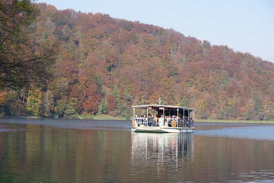 Scenic view of lake against trees during autumn