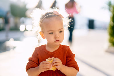 Portrait of cute girl holding ice cream