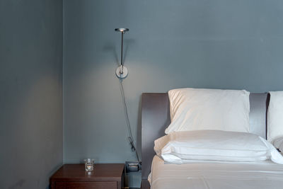 Interior of bedroom with lamp near bed