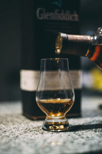 Close-up of beer glass on table