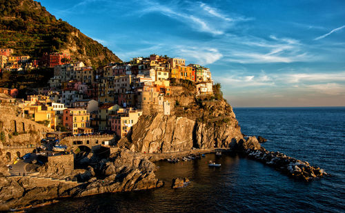 Panoramic view of sea and buildings against sky