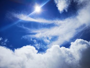 Low angle view of clouds in blue sky on sunny day