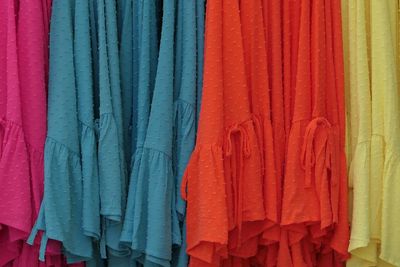 Full frame shot of colorful clothes hanging at market for sale